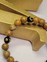 Load image into Gallery viewer, PETRIFIED WOOD AND ONYX MANTRA BRACELET
